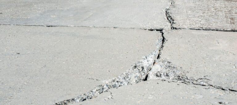 Close-up of a large crack in a concrete surface