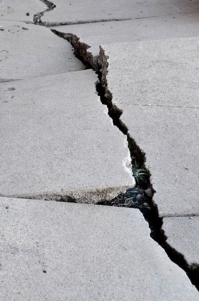 Uneven, Cracked Concrete in need of Concrete Repair services