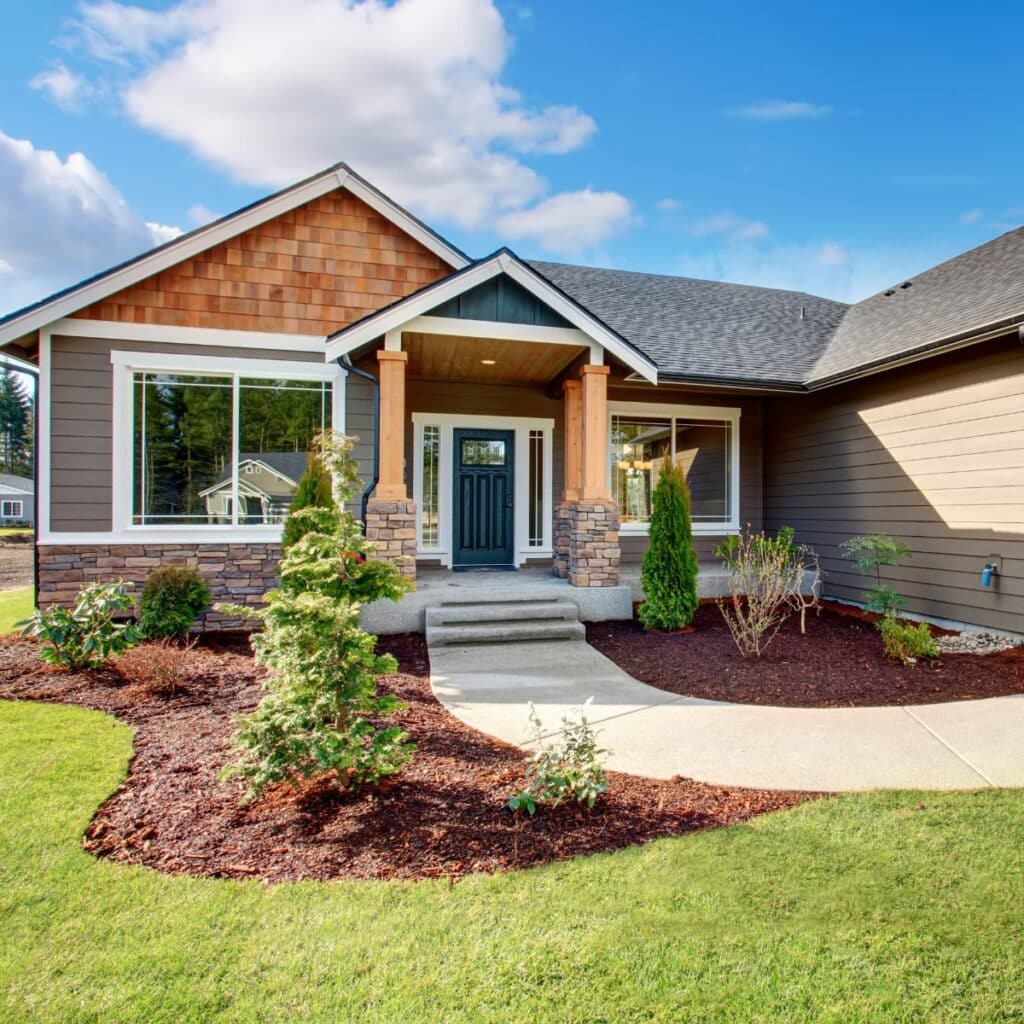 Charming single-story home with a stone façade and neatly landscaped front lawn